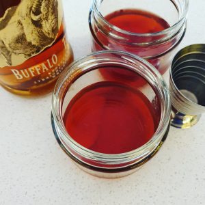 Two Boulvardier cocktails pictured from above.