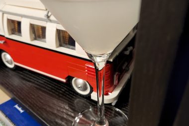 A Beachcomber Cocktail in a Martini glass in front of a Lego VW van.