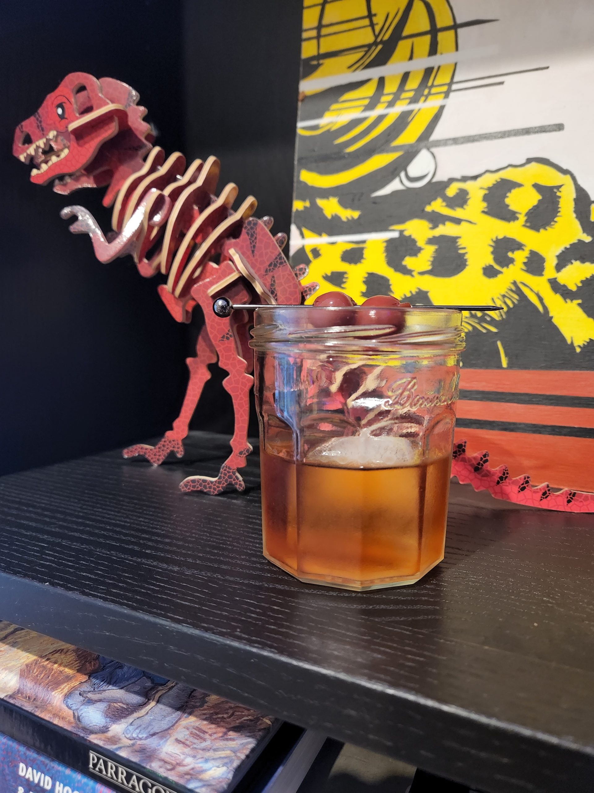 A Caribbean Old Fashioned on a bookshelf.