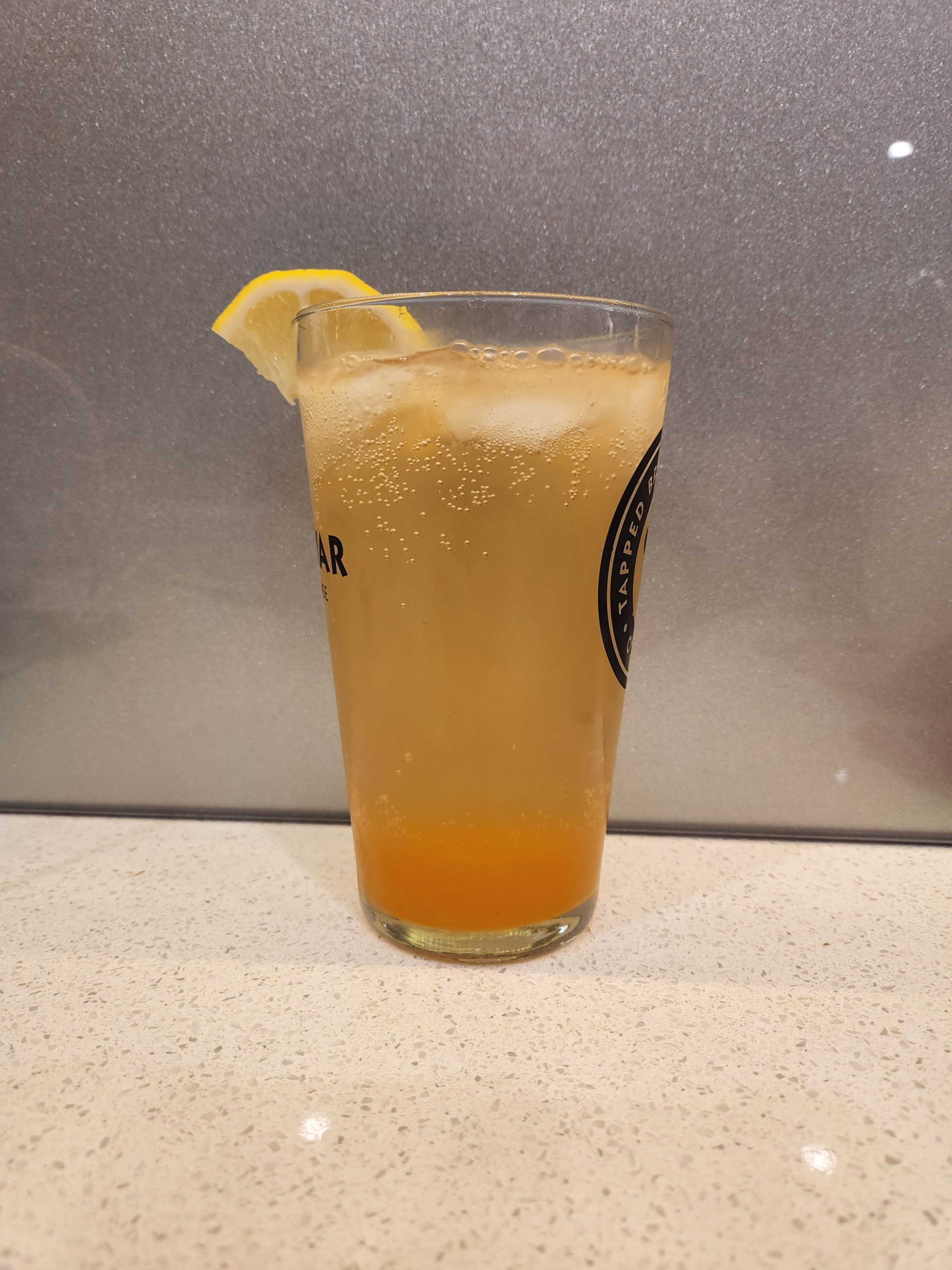 A Gin Sling cocktail in a tall glass.