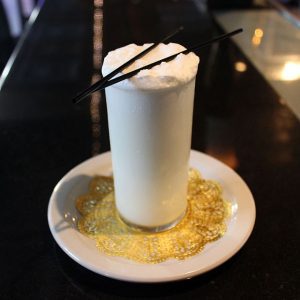 A New Orleans Fizz Cocktail on a plate.