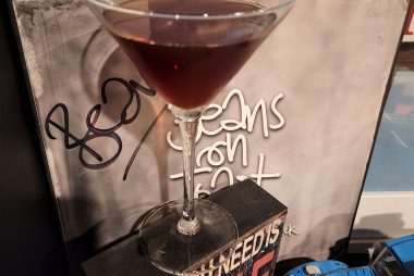 A Reverse Manhattan cocktail in front of a vinyl record.