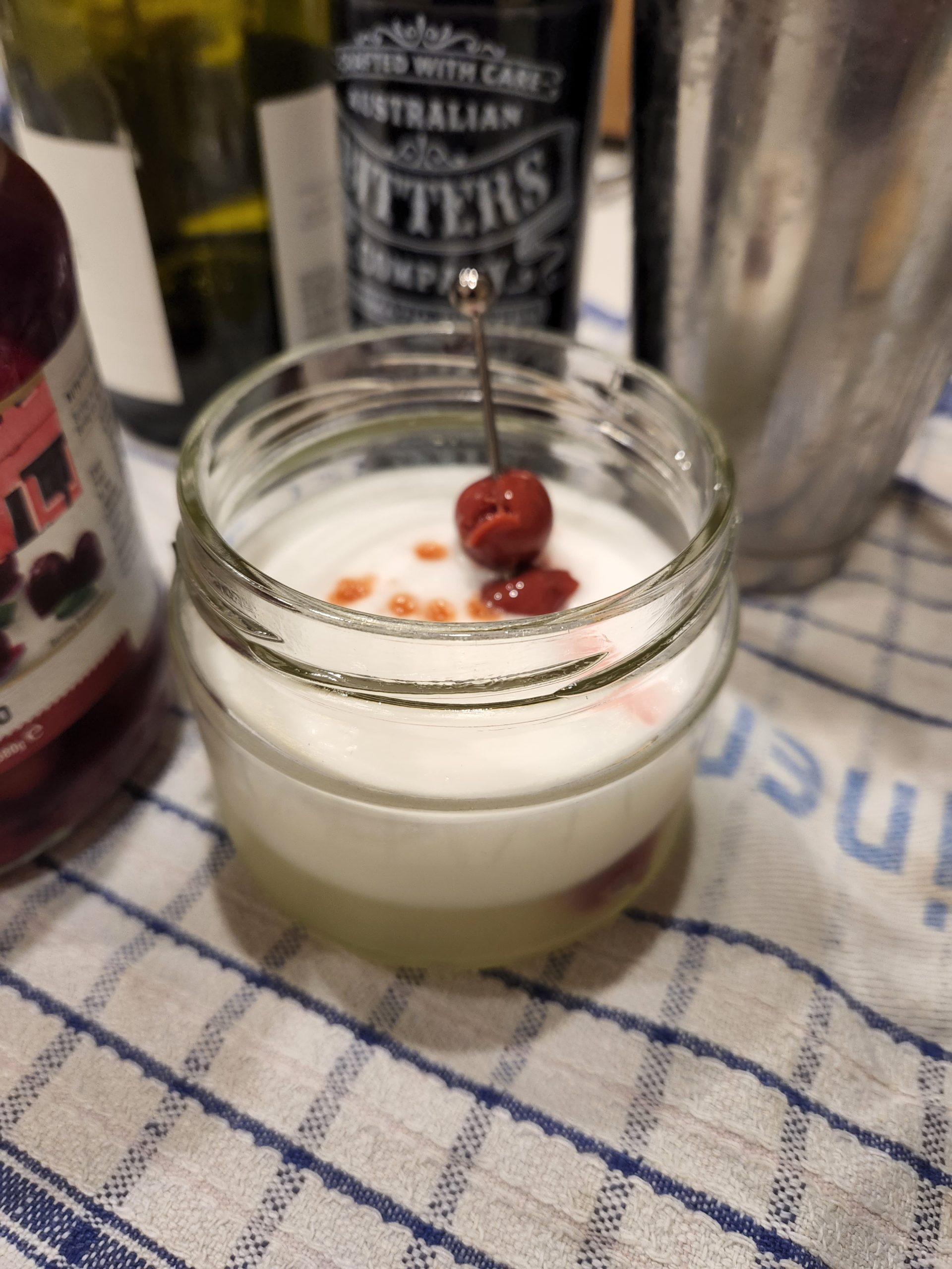A Gin Sour cocktail on a clothe.