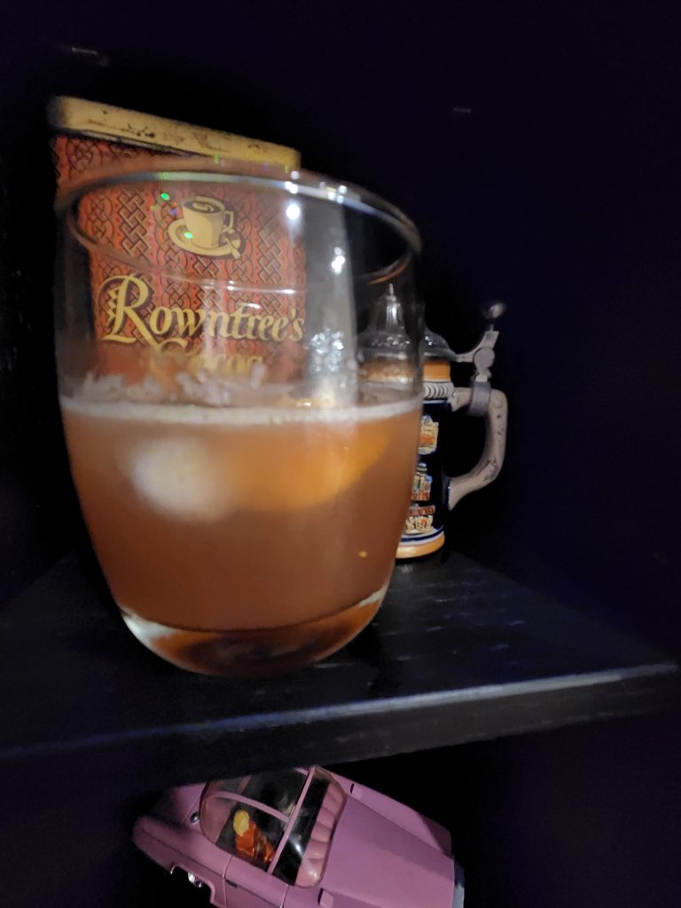 A Man O War cocktail in front of a mini German beer stein.