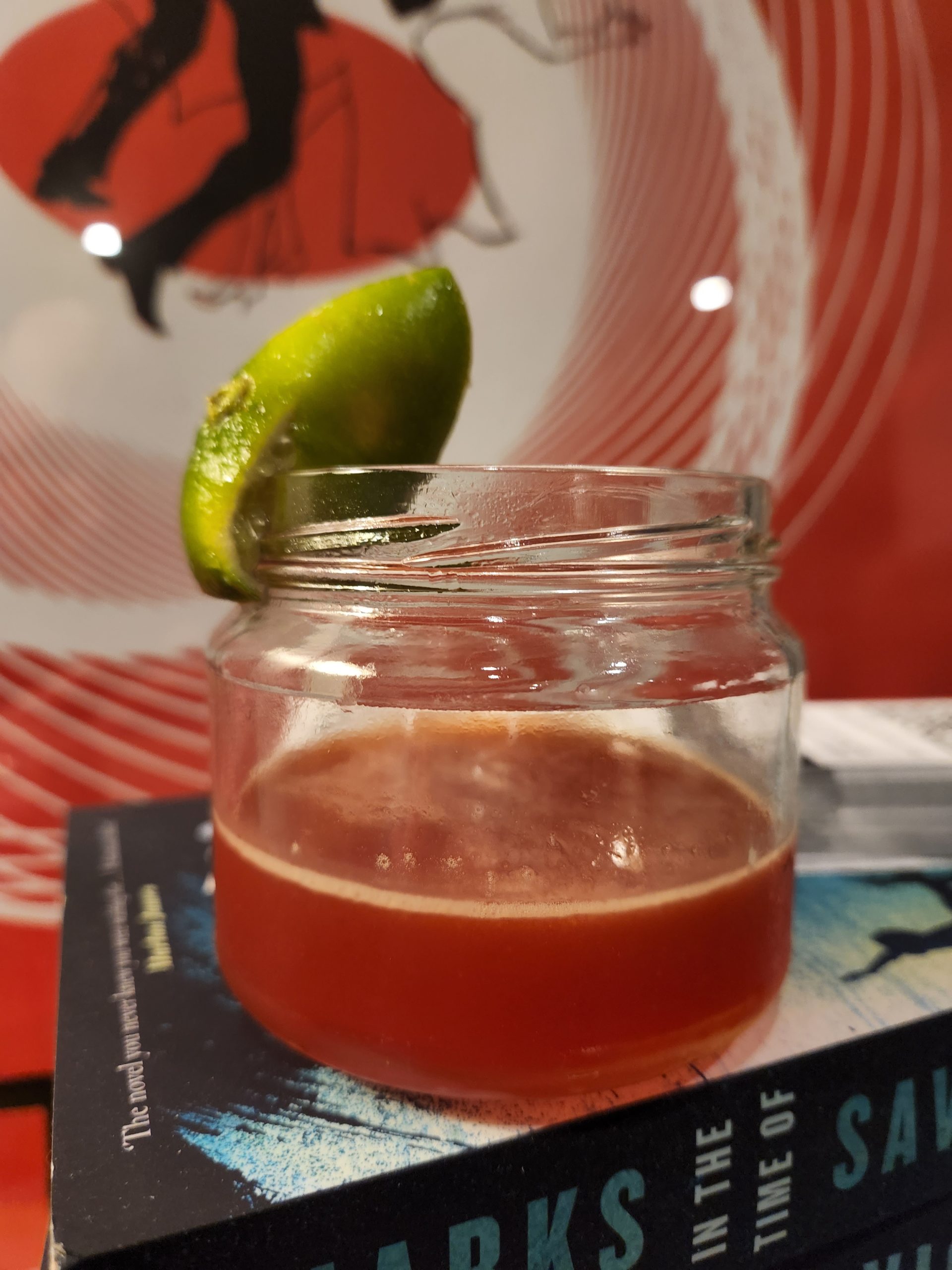A Mexican Firing Squad cocktail on a book.