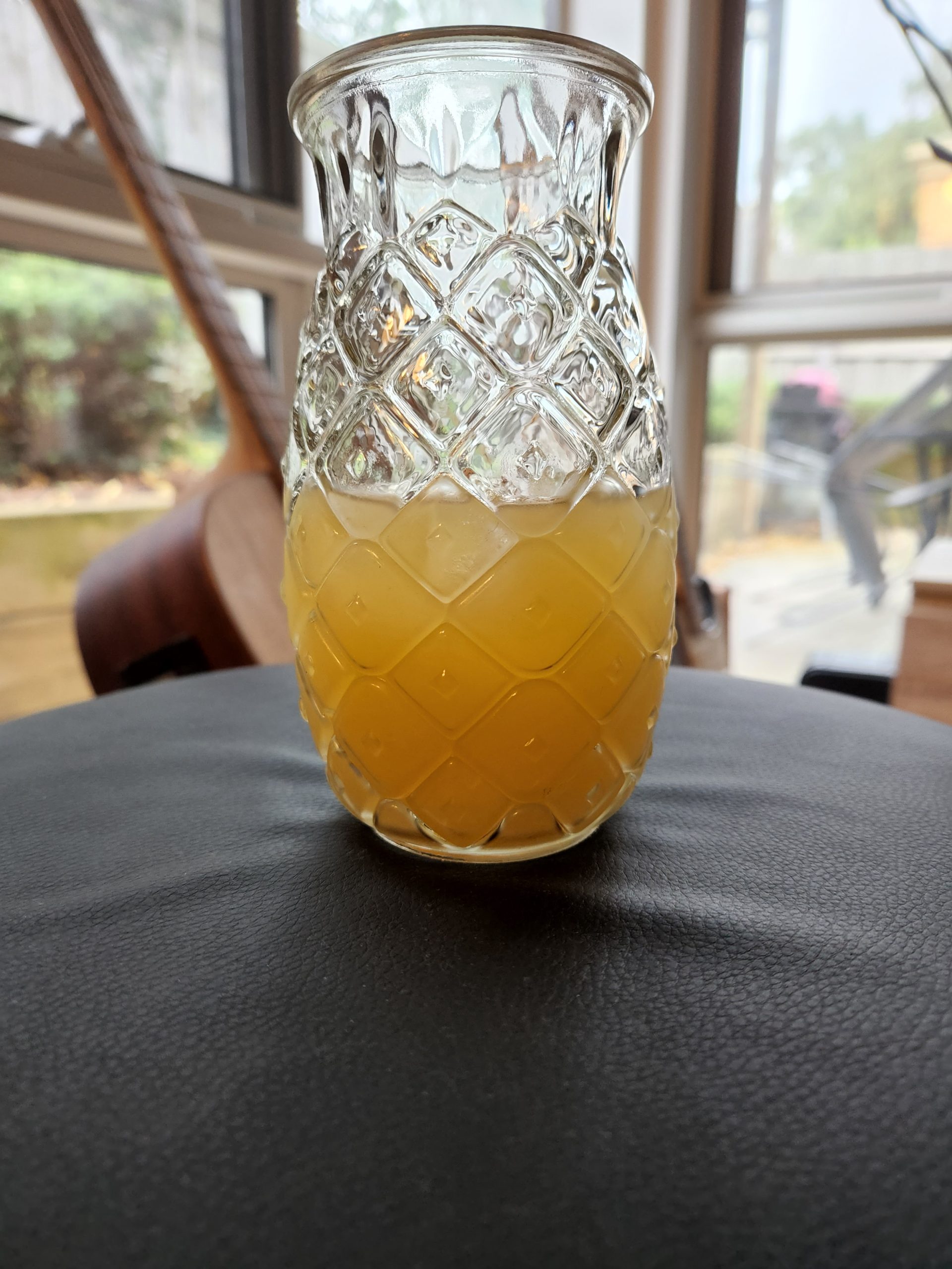 A Scorpion Bowl cocktail served in a glass that looks like a pineapple.