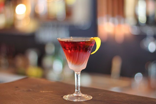 An Adonis cocktail on a bar.