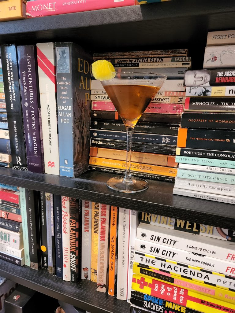 A Perfect Martini on a bookshelf.