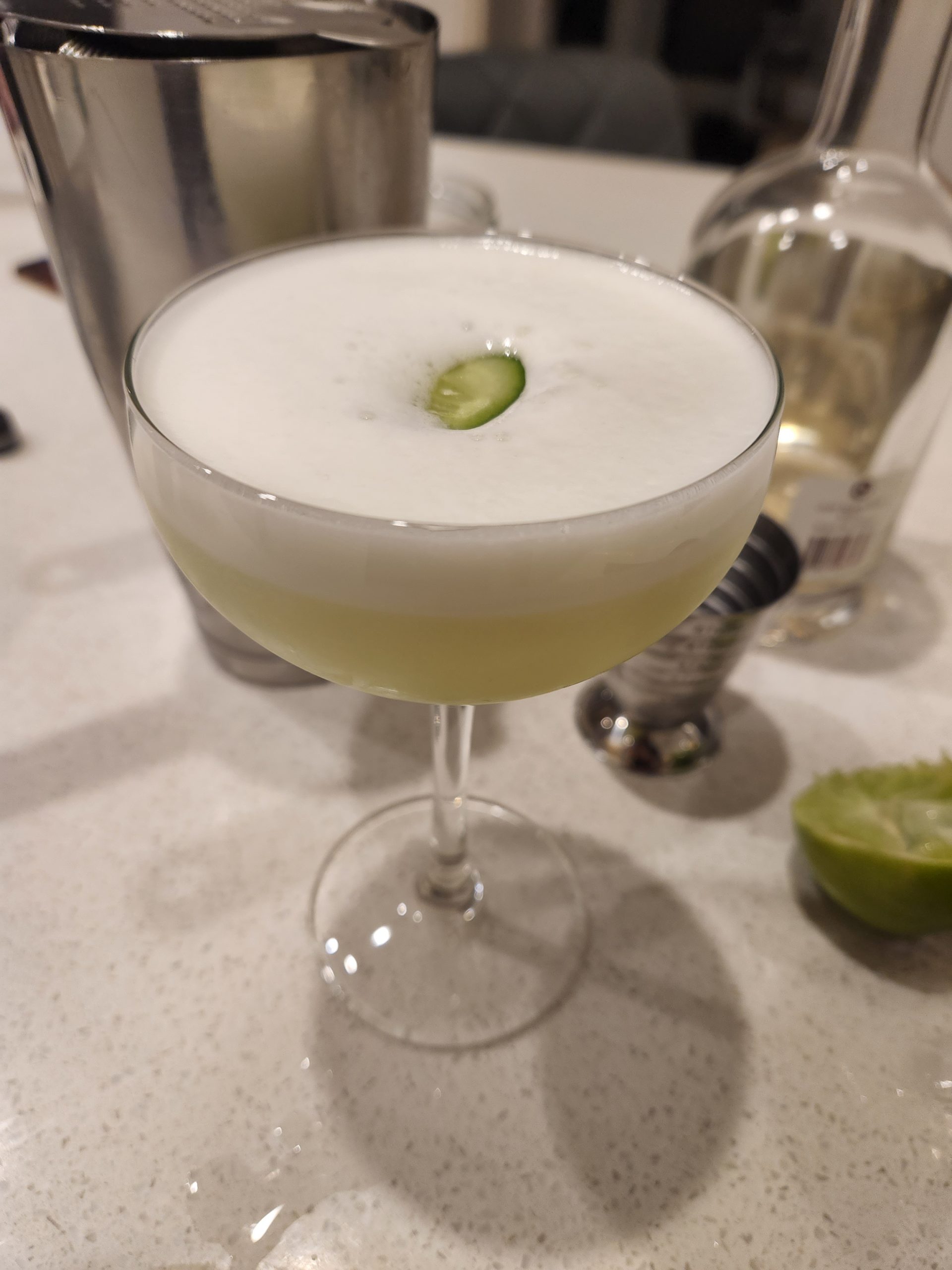 An El Pepino cocktail in a coupe glass.
