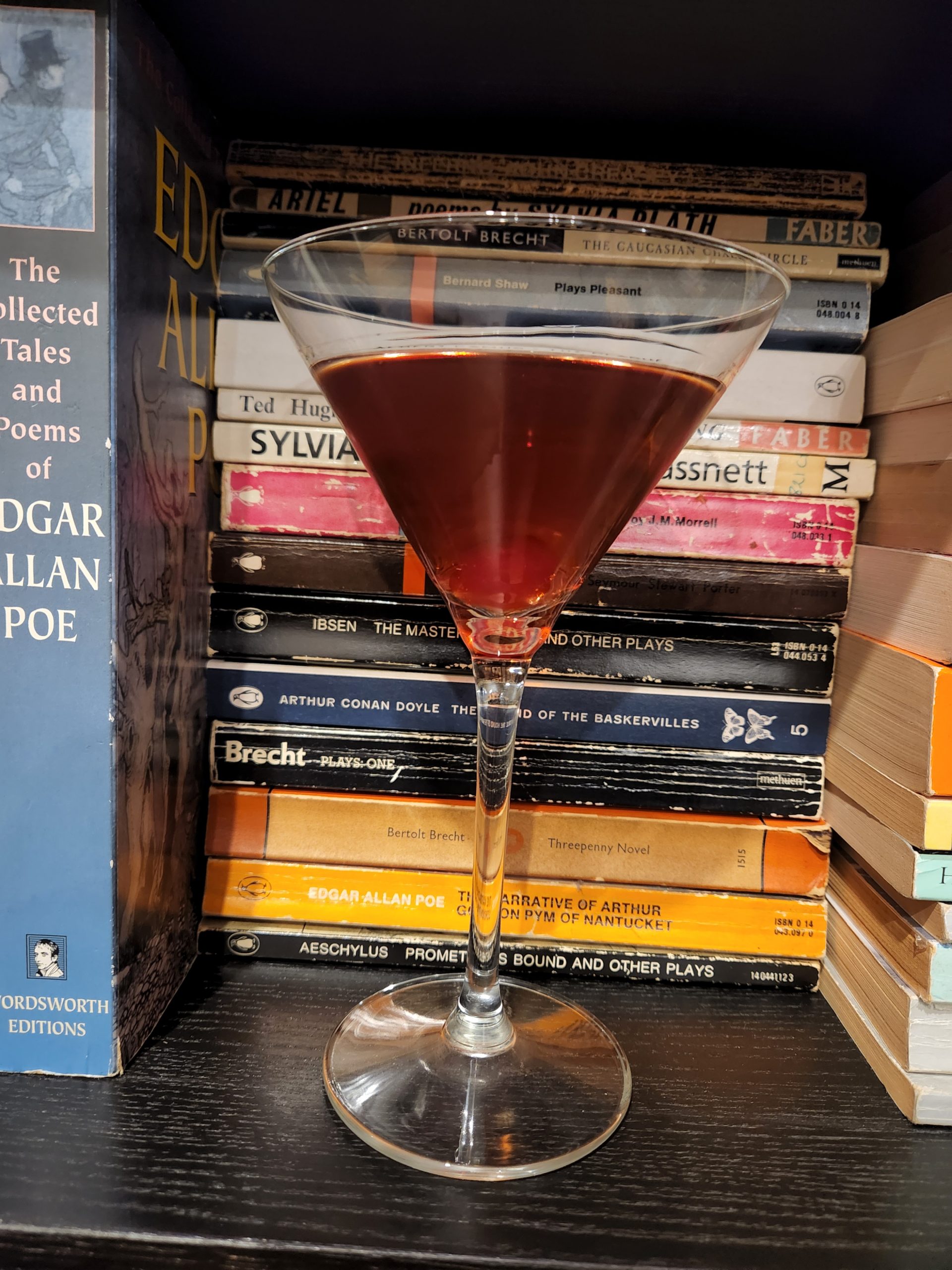 A Perfect Manhattan on a bookshelf.